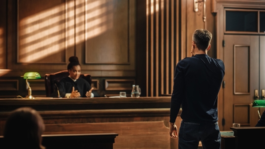 man standing before judge